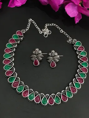 Appealing Multicolor Stone Studded Oval Shaped Designer Oxidized Necklace Set With Matching Earrings