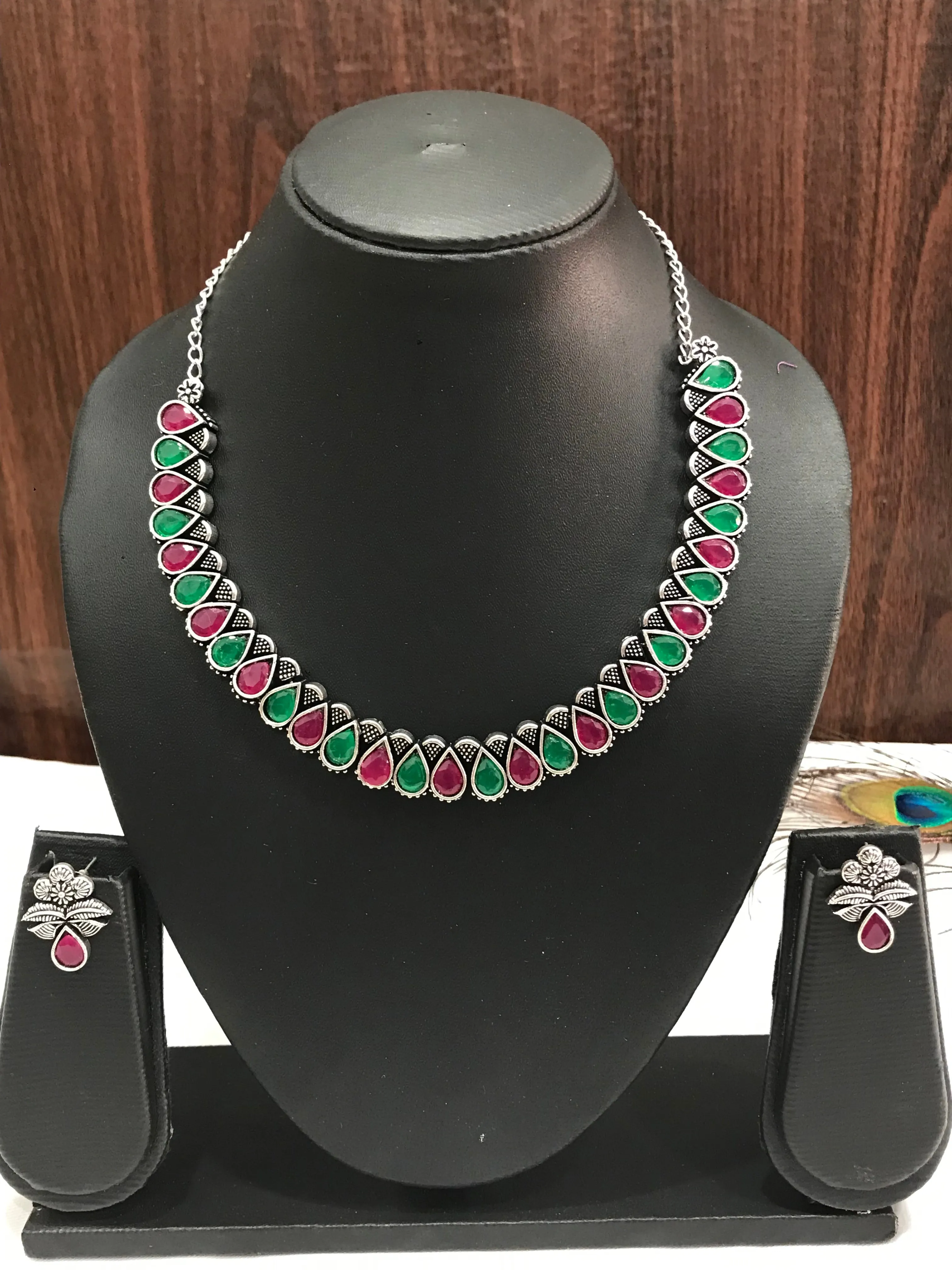 Appealing Multicolor Stone Studded Oval Shaped Designer Oxidized Necklace Set With Matching Earrings