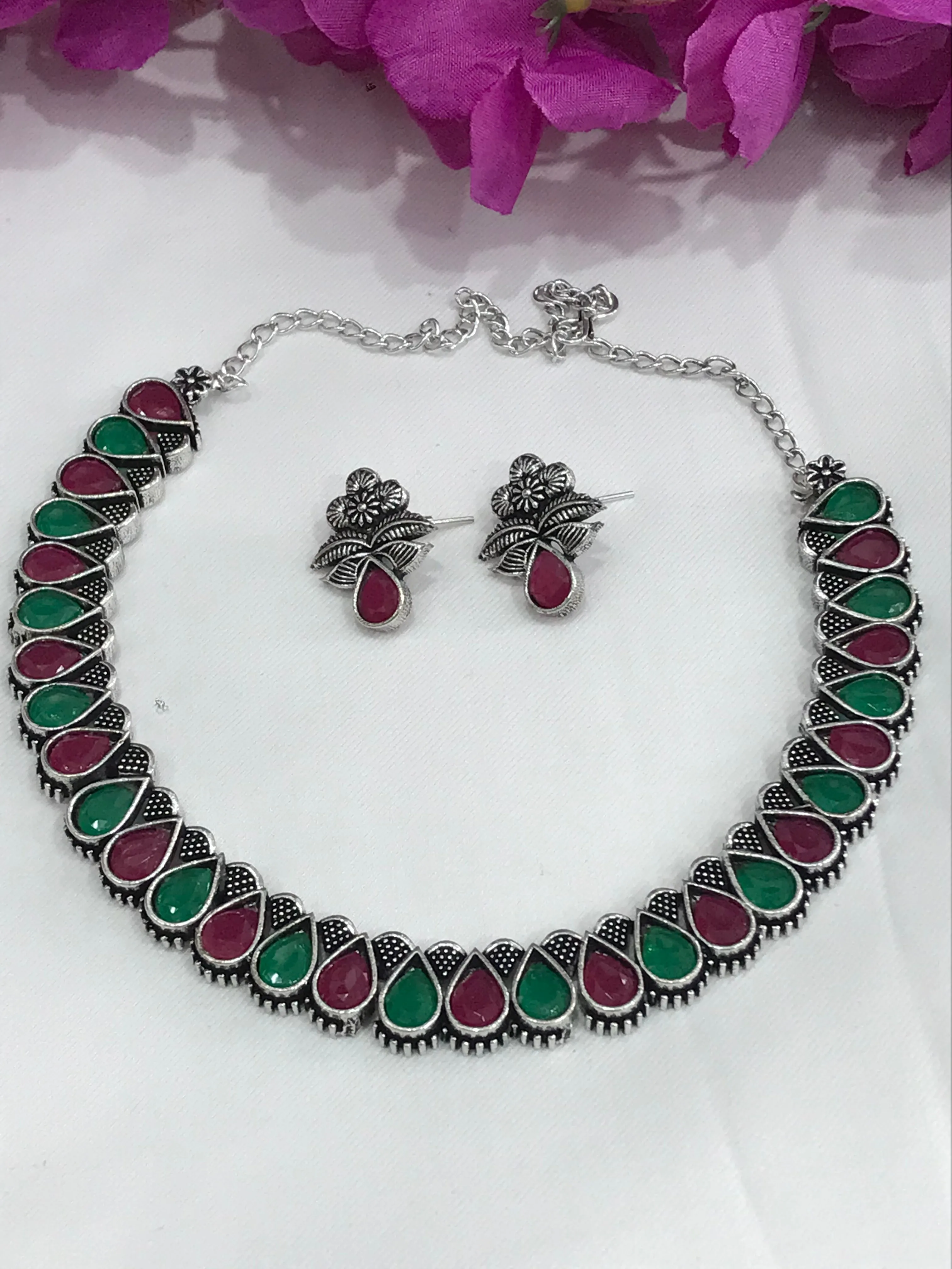 Appealing Multicolor Stone Studded Oval Shaped Designer Oxidized Necklace Set With Matching Earrings